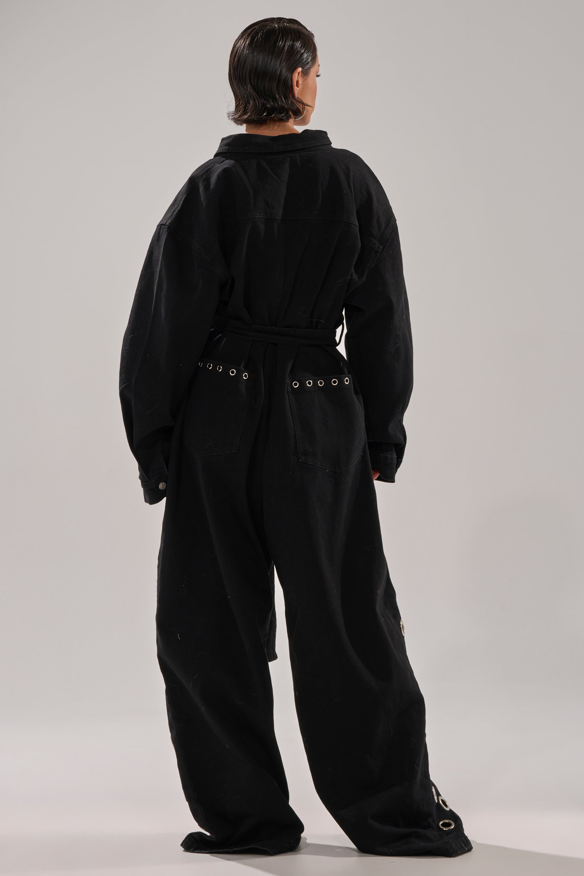 PLAY YOUR CARDS RIGHT DENIM JUMPSUIT WITH GROMMETS